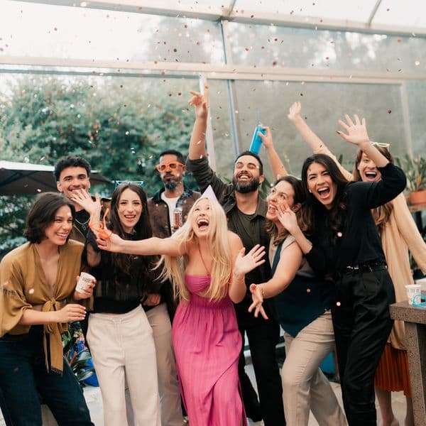 Guests cheering under a shower of confetti