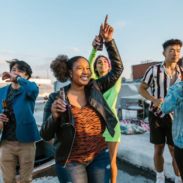 Friends celebrating at an outdoor rooftop party